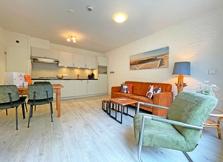 Spacious living room in Apartment Bos en Duin 08, De Dennen, Texel, with modern kitchen and comfortable seating area.