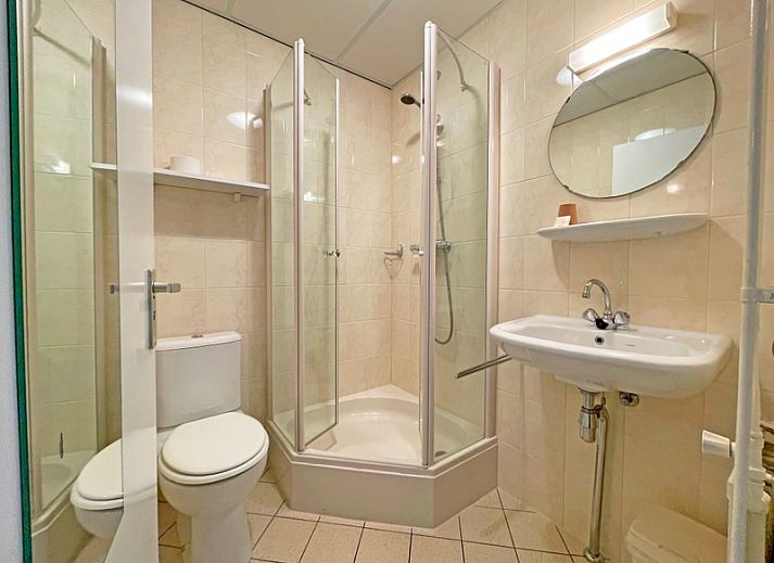 Cozy sitting area in Apartment Bos en Duin 08, De Dennen, Texel, overlooking the green surroundings.