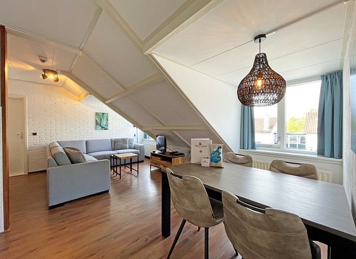 Cozy living room in Apartment Bos en Duin 33, De Dennen, Texel with modern decor and lots of natural light.