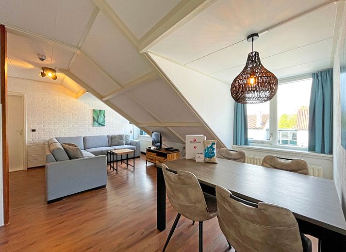 Cozy living room in Apartment Bos en Duin 33, De Dennen, Texel with modern decor and lots of natural light.