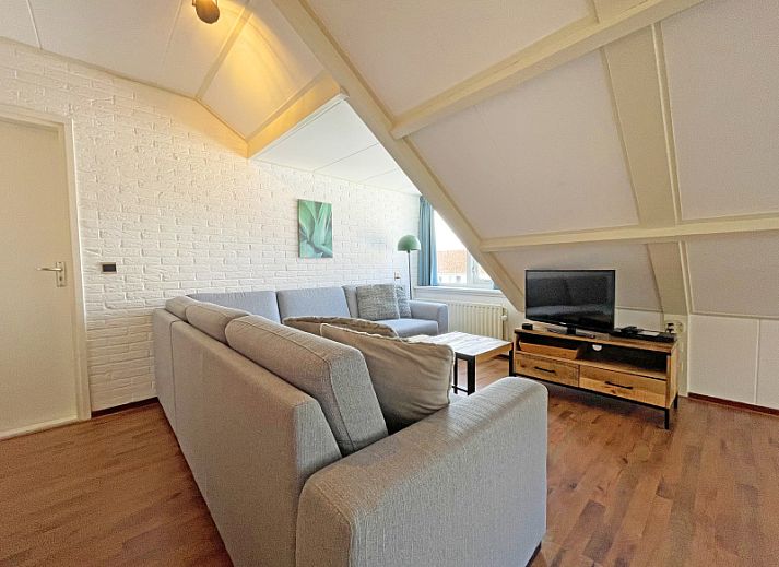 Cozy living room in Apartment Bos en Duin 33, De Dennen, Texel with modern decor and lots of natural light.
