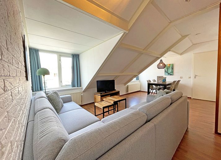 Cozy living room in Apartment Bos en Duin 33, De Dennen, Texel with modern decor and lots of natural light.