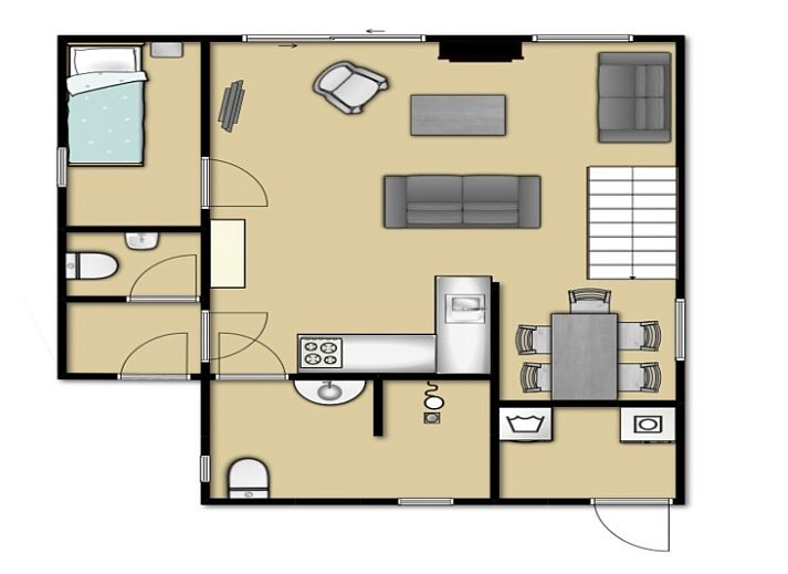 Gemuetliche Essecke im Ferienhaus Gortersmient 210, De Dennen, Texel mit Treppe zum Obergeschoss.