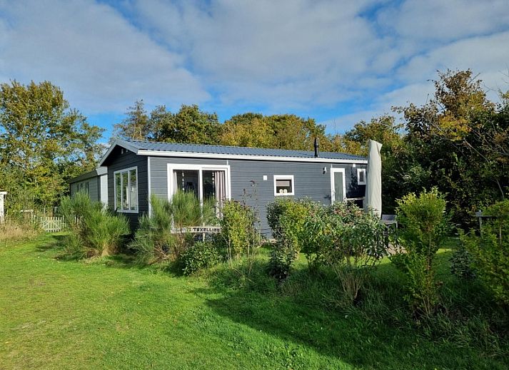 Vakantiepark de Bremakker - Weideveld 71, charmant vakantiehuis in De Dennen, Texel, omgeven door groen en rust.