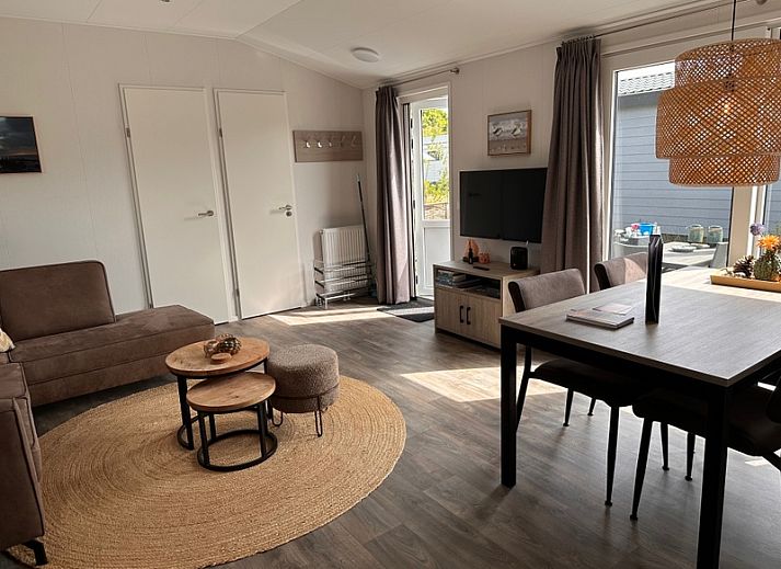 Enjoy the terrace at Chalet Wulk, Vakantiepark de Bremakker, Texel, in the sunny nature of De Dennen.