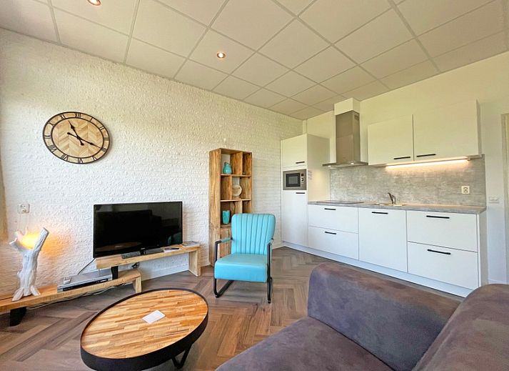 Apartment Bos en Duin 02 in De Dennen, Texel offers a spacious living room with modern interior and plenty of natural light.