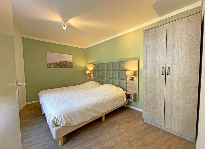 Gemuetliche Sitzecke im Apartment Bos en Duin 09, Ferienunterkunft in De Dennen, Texel mit Sofa und Sesseln.