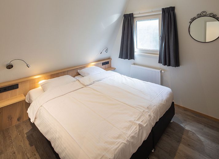 Gezellige woonkamer in vakantiehuis Gortersmient 224, Bungalowpark Gortersmient, De Dennen, Texel. Ideaal voor ontspanning op de Waddeneilanden.