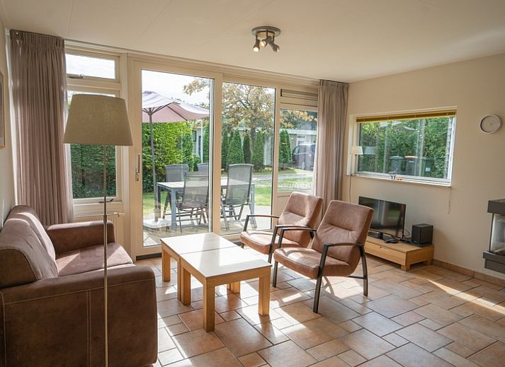 Bungalow Uterste Coogh 98 in De Dennen, Texel with spacious garden and terrace for relaxing stay.