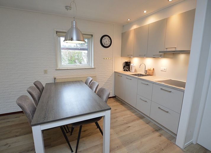 Cozy living room of Holiday home de Parel 196, Texel, with comfortable seating.
