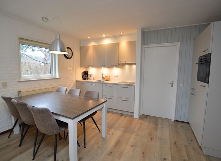 Cozy living room of Holiday home de Parel 196, Texel, with comfortable seating.