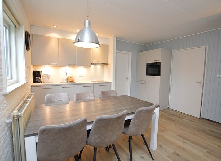 Cozy living room of Holiday home de Parel 196, Texel, with comfortable seating.