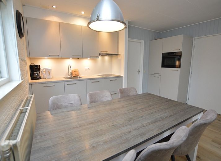 Cozy living room of Holiday home de Parel 196, Texel, with comfortable seating.