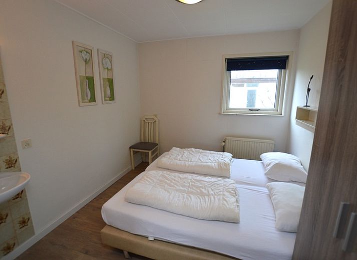 Cozy living room of Holiday home de Parel 196, Texel, with comfortable seating.