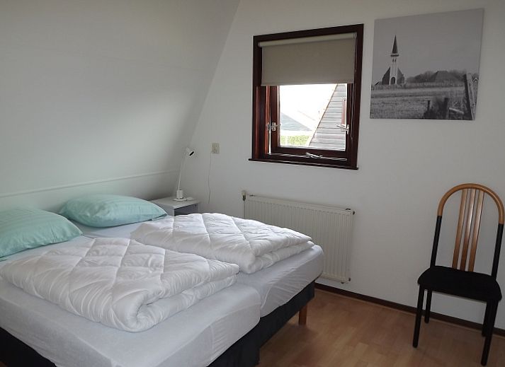 Geniessen Sie die sonnige Terrasse des Ferienhauses Gortersmient 234 in De Dennen, Texel fuer einen entspannten Aufenthalt.