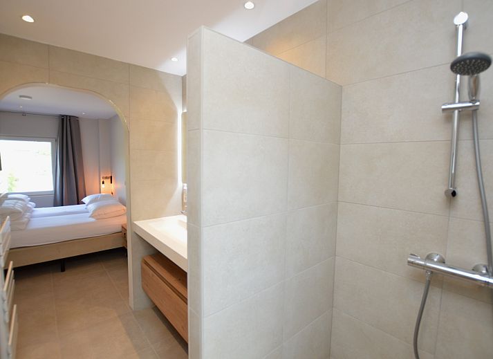 Gezellige zithoek met flatscreen TV in vakantiehuis Tempelierweg - Kogermient 18, De Dennen Texel.