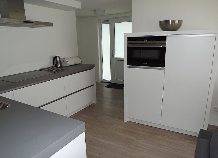 Cozy living room of Holiday home Gortersmient 350 in De Dennen, Texel, with comfortable seating area.