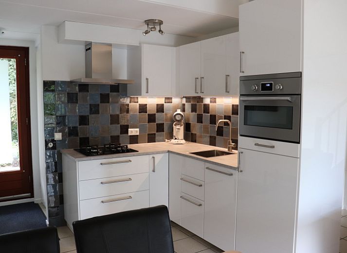 Vakantiehuis Gortersmient 290 in De Dennen, Texel, met een charmante buitenruimte en terras.