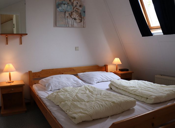 Gezellige woonkamer van Vakantiehuis Gortersmient 290 in De Dennen, Texel, met veel natuurlijk licht.