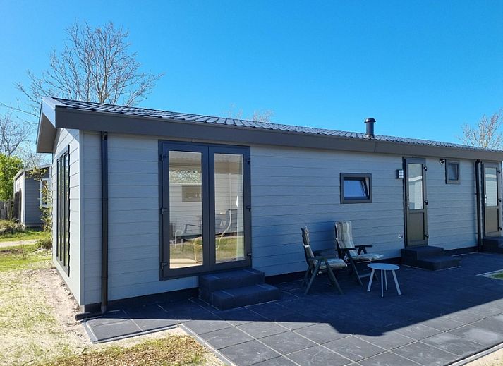 Vakantiepark de Bremakker - Bosveld 146, ein charmantes Ferienhaus in De Dennen, Texel, umgeben von gruener Natur und Ruhe.
