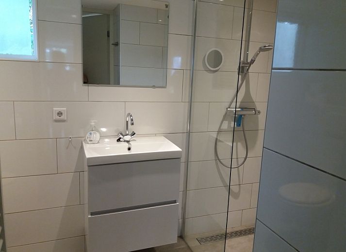 Gezellige woonkamer van Bollenveld - de Iris, vakantiehuis in De Dennen, Texel met comfortabele zitruimte.