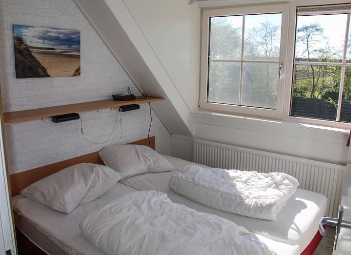 Gemuetliches Wohnzimmer des Ferienhauses Ekster in De Dennen, Texel, ideal fuer einen Familienurlaub auf den Watteninseln.