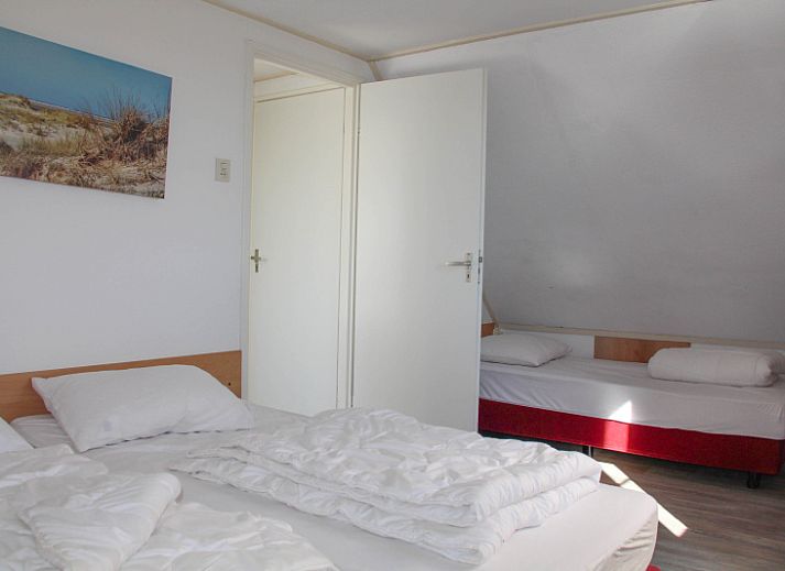 Gemuetliches Wohnzimmer des Ferienhauses Ekster in De Dennen, Texel, ideal fuer einen Familienurlaub auf den Watteninseln.