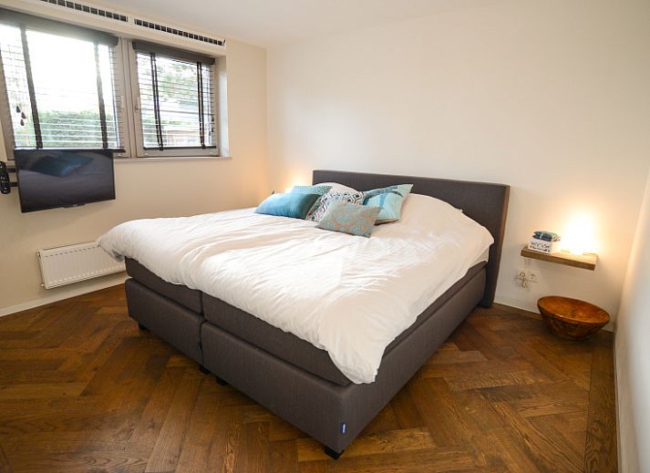 Stylish living room of Bungalowpark Oud Vredelust - Zeeskuum, Texel with open kitchen