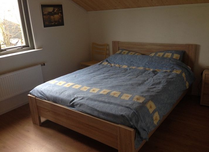 Rustig gelegen vakantiehuis De Trekvogels in Formerum, Terschelling omgeven door groen.