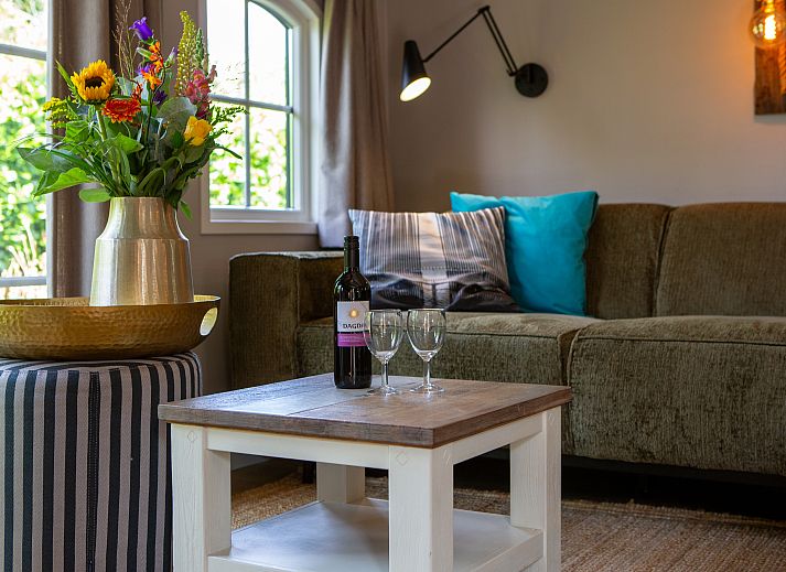 Cozy living room in Schuttersbos vacation home, Midsland, Terschelling with comfortable sofa.