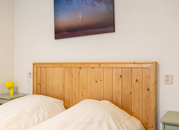 Front view of Apartment Bath Douche in Oosterend, Terschelling with sunny garden and deck chairs.