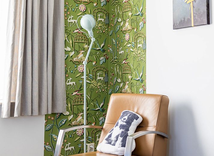 Cozy bedroom in Apartment Bath Douche, Oosterend, with wooden headboard and star painting.