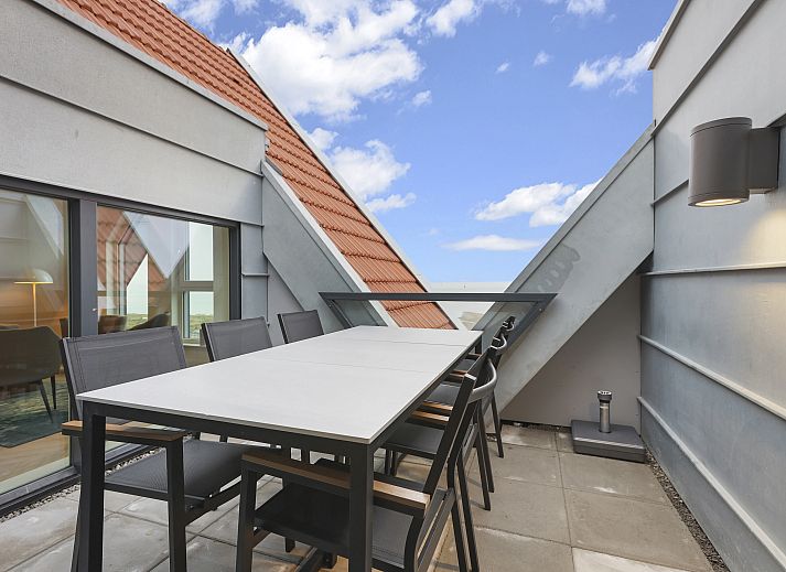 Gezellige woonkamer in 4-6-persoons penthouse 4-6LP, West-Terschelling met uitzicht op de Waddenzee.