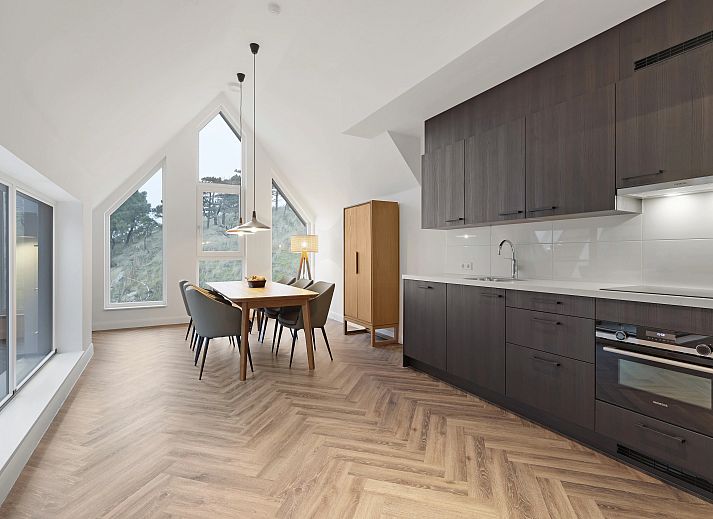 Comfortable sitting area in vacation home 6LP in West Terschelling, ideal for relaxation.