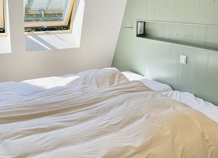 Gezellig terras bij vakantiehuisje in Ballum, Ameland, ideaal voor ontspanning.