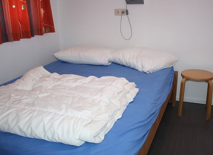 Gemuetliches, modern eingerichtetes Wohnzimmer im Ferienhaus De Branding auf Ameland.