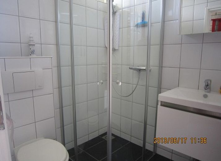 Gezellige woonkamer in De Klipper, vakantiehuis Ballum Ameland met comfortabele zitruimte.