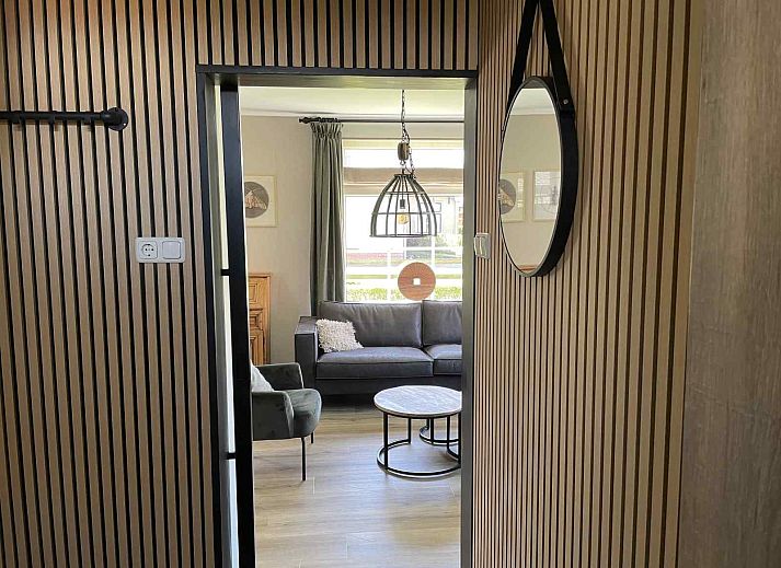 Iconic lighthouse near vacation home WA003 in Buren, Ameland, surrounded by dunes.