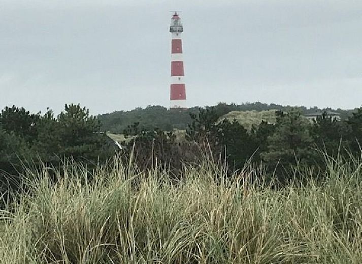 Dining area in mobile home De Hout, Buren, Ameland, ideal for cozy meals during your vacation.