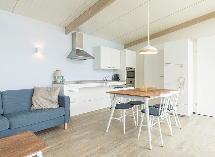 Gemuetliches Wohnzimmer im Ferienhaus Wadden Special, Hollum, Ameland. Gemuetliche Sitzecke und moderne Einrichtung auf den Watteninseln.