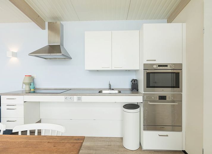 Gemuetliches Wohnzimmer im Ferienhaus Wadden Special, Hollum, Ameland. Gemuetliche Sitzecke und moderne Einrichtung auf den Watteninseln.