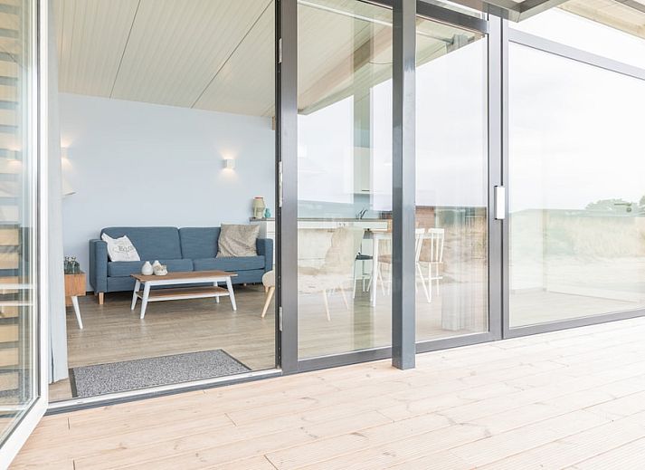 Gemuetliches Wohnzimmer im Ferienhaus Wadden Special, Hollum, Ameland. Gemuetliche Sitzecke und moderne Einrichtung auf den Watteninseln.