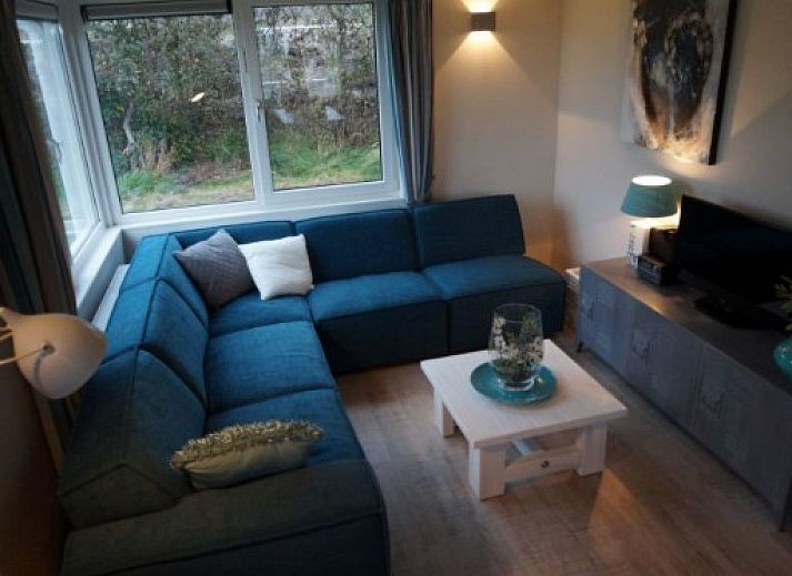 EILANDLODGE 4 vakantiehuis met veranda in Hollum, Ameland omgeven door natuur.