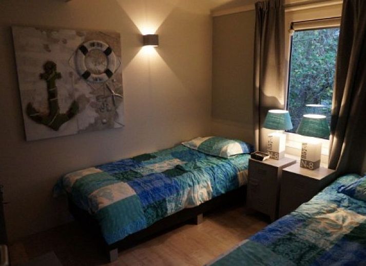 EILANDLODGE 4 vakantiehuis met veranda in Hollum, Ameland omgeven door natuur.