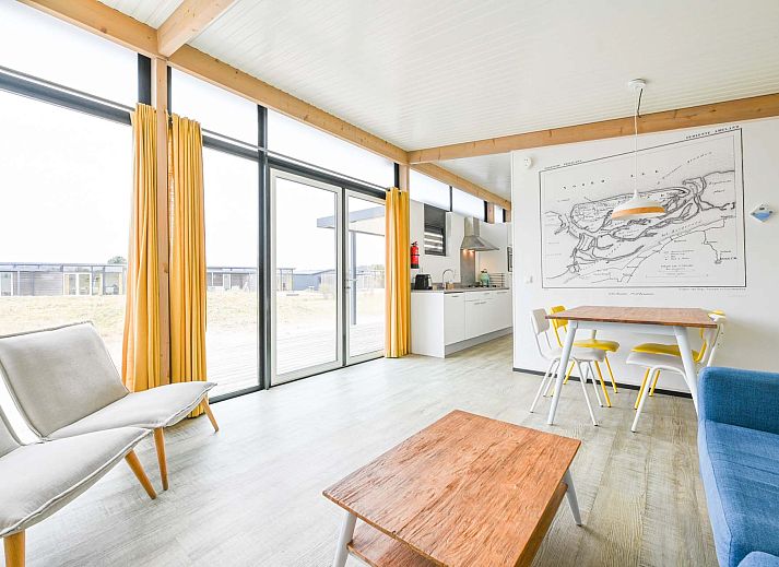 Detached house in Hollum, Ameland with modern veranda and glass facades, ideal for vacations on the Wadden Islands.