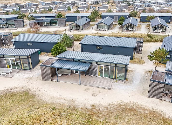 Cozy sitting area on the veranda of Detached house in Hollum, Ameland, perfect for relaxation on the Wadden Islands.