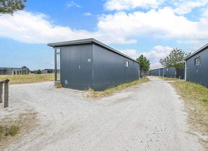 Cozy sitting area on the veranda of Detached house in Hollum, Ameland, perfect for relaxation on the Wadden Islands.