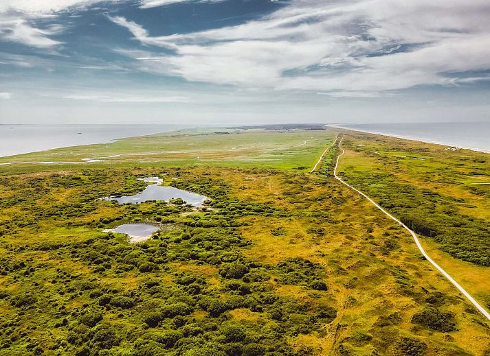 Bright living room of Detached house in Hollum, Ameland with large windows and modern interior on the Wadden Islands.