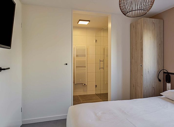 Veranda mit Naturblick im Ferienhaus in Hollum, Ameland, Watteninseln.