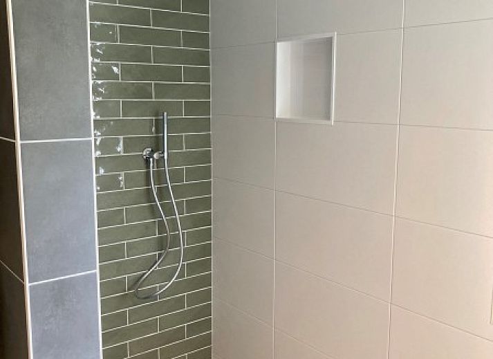 Uitzicht op weiland vanuit Zonnehoeve- zonnewende vakantiewoning in Hollum, Ameland.